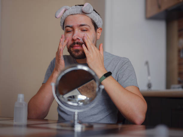 istock Men's beauty concept. caucAsian guy checking his skin. 1389521249