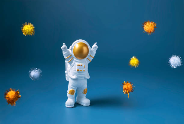 istock Happy astronaut standing with raised hands 1389522737