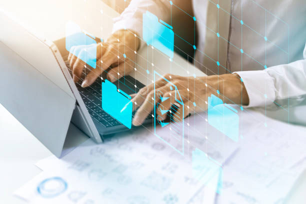 istock Entrepreneurs check documents for doing business with partners.,Employees opening data files in the office. 1389522965