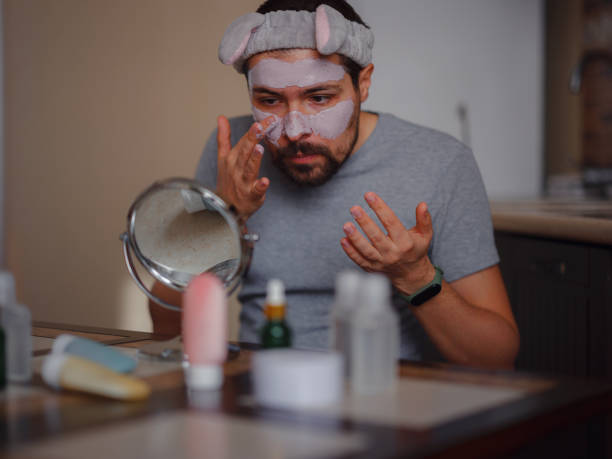 istock Men's beauty concept. caucAsian guy checking his skin. 1389523376