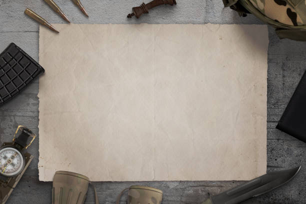 istock Blank military map on desk surrounded by army equipment 1389524057