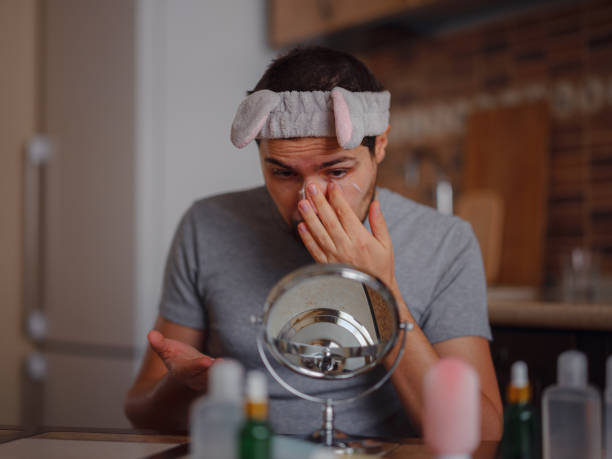 istock Men's beauty concept. caucAsian guy checking his skin. 1389524936