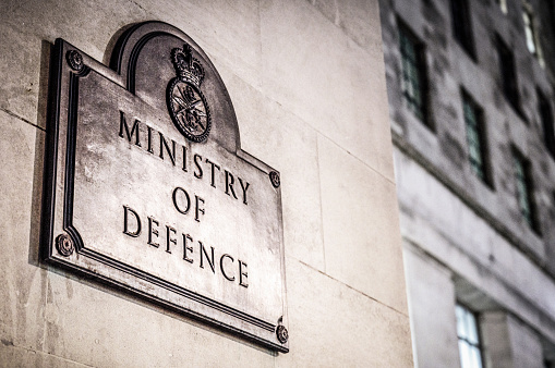 Close-up of a sign for the Ministry of Defence, a department of the UK Government in Whitehall, London.