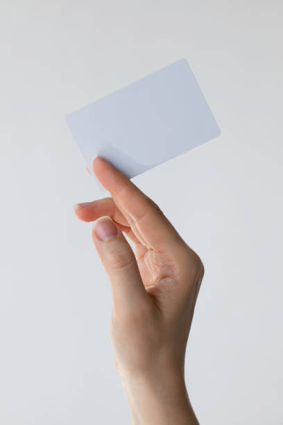 istock Woman Holding Plastic Card 1389528884