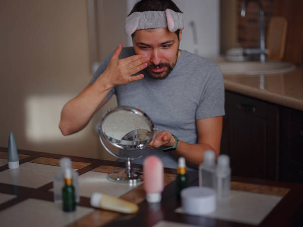 istock Men's beauty concept. caucAsian guy checking his skin. 1389530201