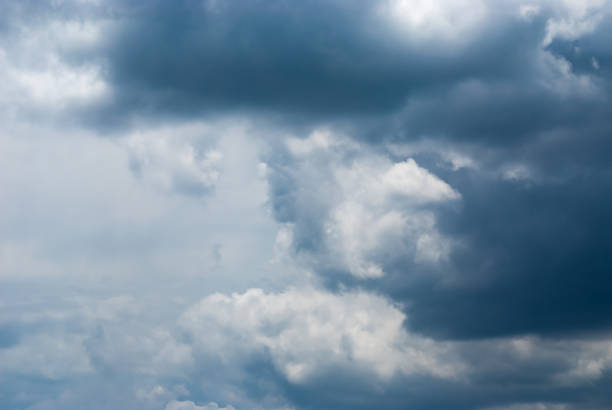 Blue sky background with clouds. Natural background.