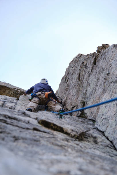 istock A Unrecognizable man climbing on overhanging cliff rock 1389533892