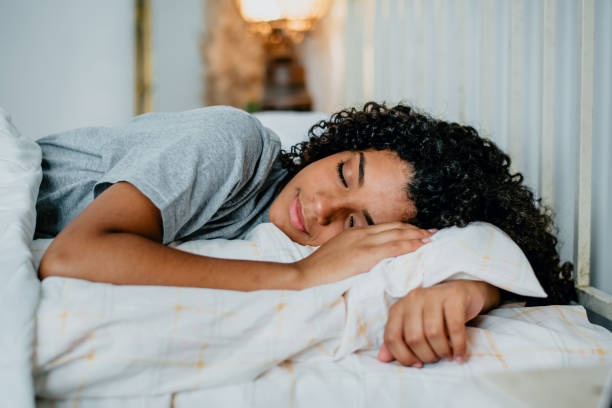 istock teenager sleeping in bed 1389534667