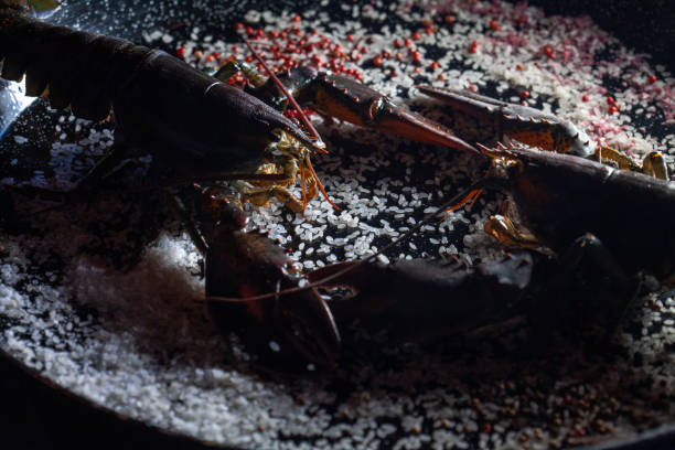 aragosta fresca - seafood lobster paella prepared shellfish foto e immagini stock