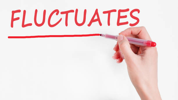 istock hand writing Fluctuates with marker, concept background 1389541452