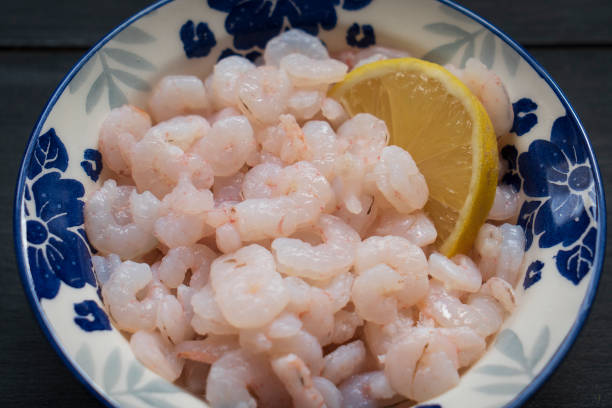 istock Fresh shrimp served with lemon 1389546518