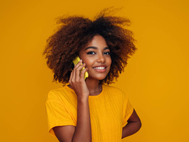 istock Woman holding a smart phone 1389547312