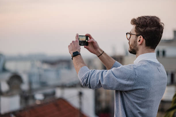 istock A young man is photographing city scape 1389547354