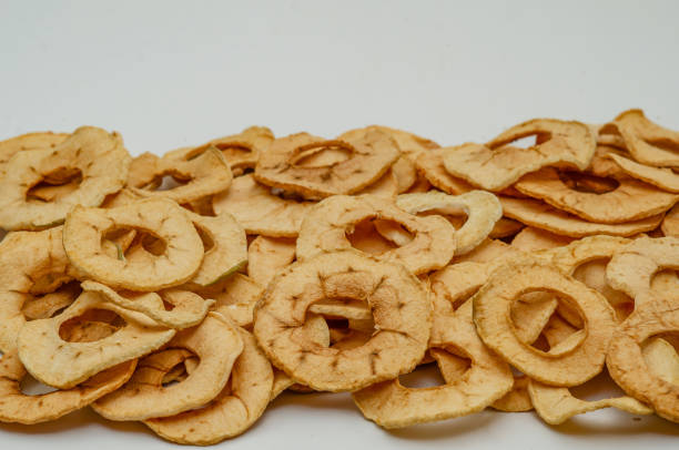 istock Round slices of dried apples on a white background. Apple chips. 1389549130
