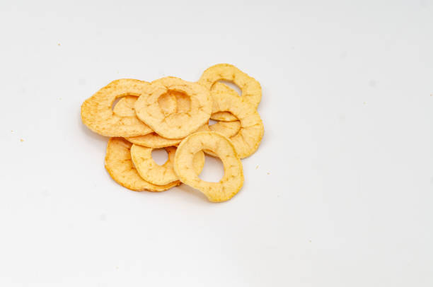 Apple chips. Useful dried fruits for light snack. White background.