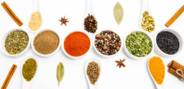 istock cooking, set of different culinary spices in white ceramic bowls and spoons, on white background, top view 1389550345