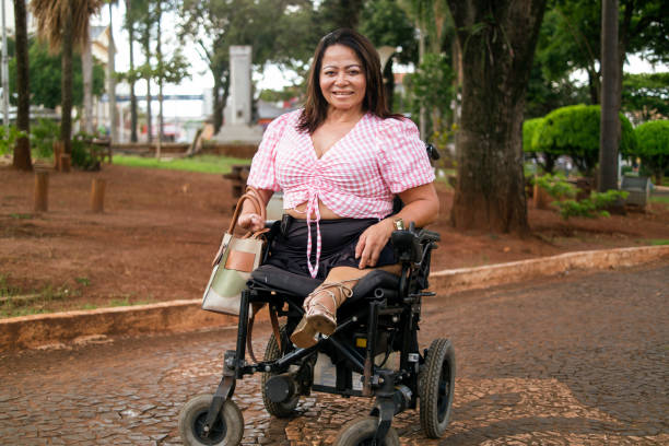 istock Woman with disability at the park. 1389551553