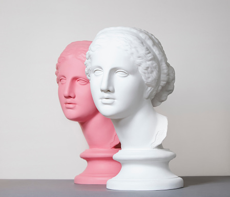 White and pink toned plaster head models (mass produced replica of Head of Aphrodite of Knidos)