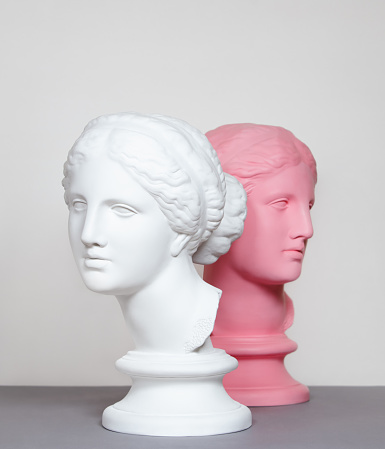 White and pink toned plaster head models (mass produced replica of Head of Aphrodite of Knidos)