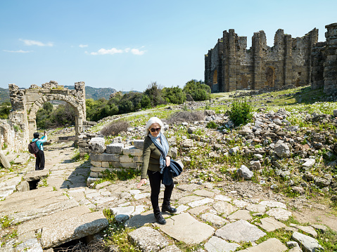 Photo of senior woman and daughter in ancient city of Aspendos, Antalya, Turkey. Shot under daylight.