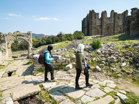 Photo of senior woman and daughter in ancient city of Aspendos, Antalya, Turkey. Shot under daylight.