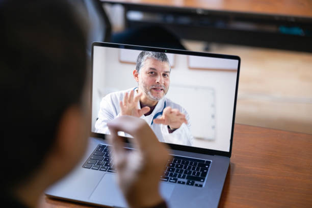 istock Physician having online meeting with a patient 1389557340