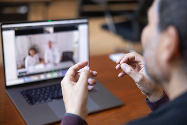 Mature man consulting doctors over telemedicine