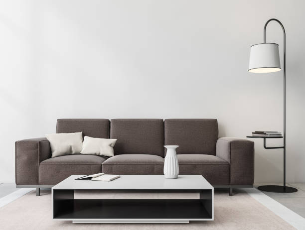istock Relaxing room interior with couch and coffee table with lamp. Mockup 1389557808