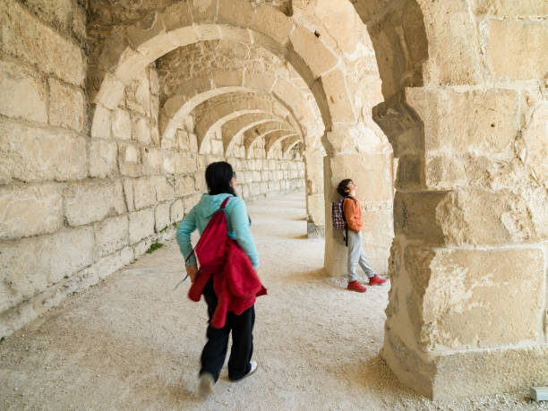istock Mother and son in historical ruin 1389557831