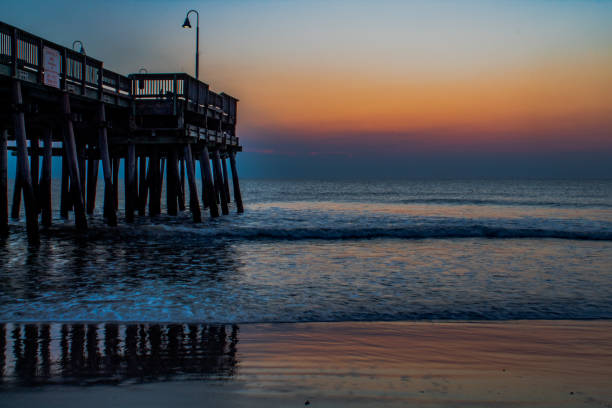 istock Sunrise at the Sandbridge beach pier 1389559389