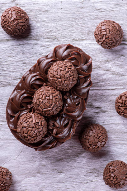 istock Handmade chocolate Easter egg, Brazilian style. Made with chocolate and brigadiers. Top view. 1389560864