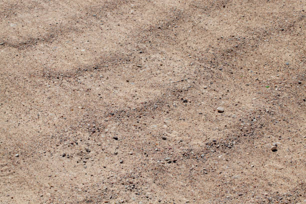 istock features on paved sandy road in rural area 1389562464