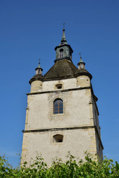 istock Large medieval stone tower with windows and crosses in several tiers 1389562879