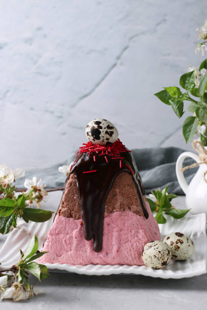 istock Easter Orthodox Curd dessert with cherries and chocolate, decorated with quail eggs on gray background. 1389566350
