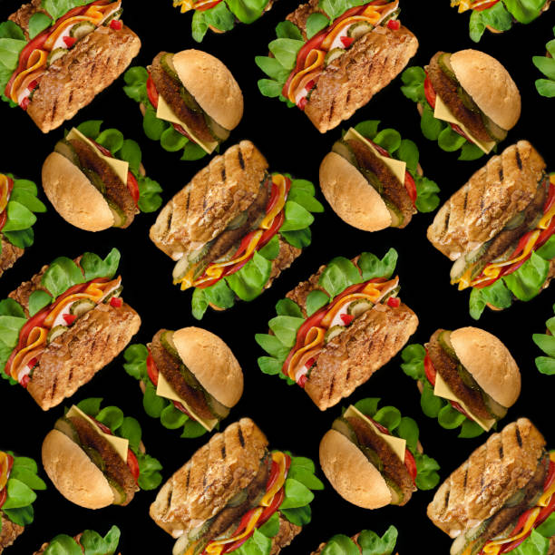 Seamless pattern of different sandwiches on a black square background. Selective focus stock photo