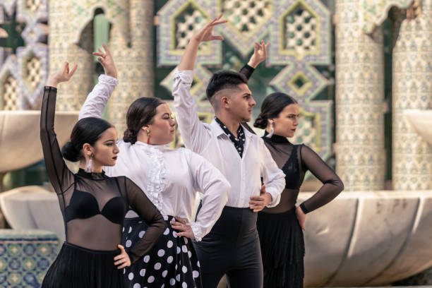 istock 4 flamenco dancers lined up dancing and facing forward 1389571798