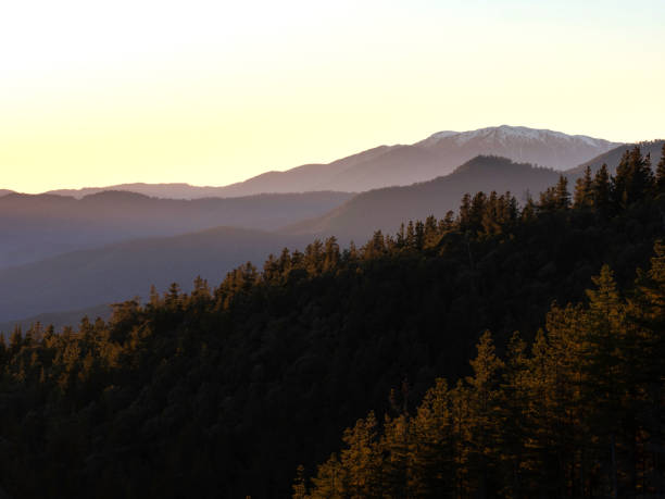Early morning sunrise over snow covered mountains