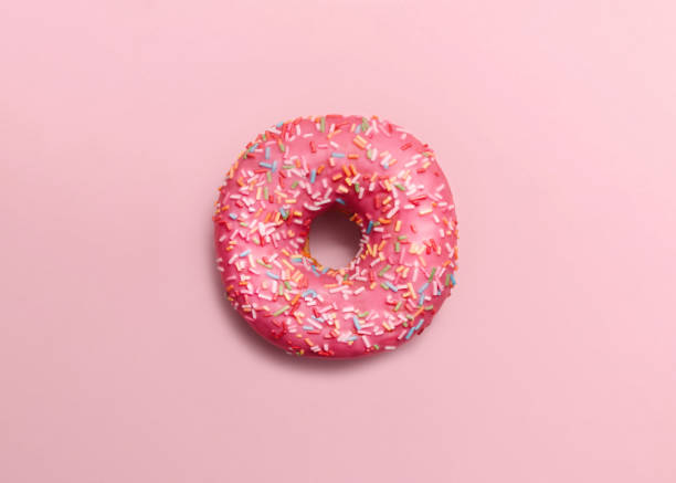 istock Donut. Flat lay photo in minimal style. 1389573899