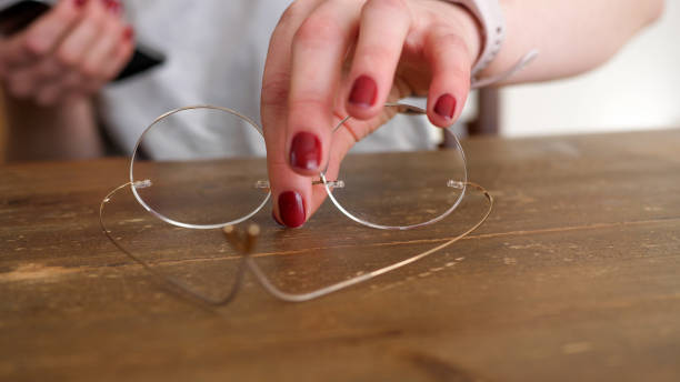 istock Young woman taking glasses from a table 1389575241