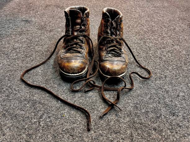 Old leather mountain shoe isolated on white background