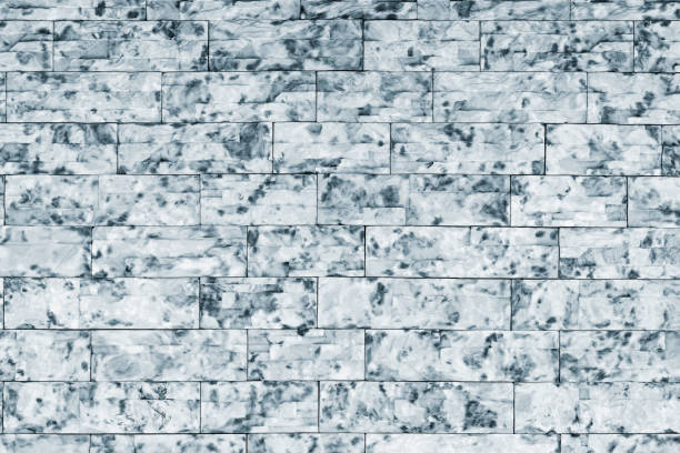 Gray brick wall background outside of the building.
