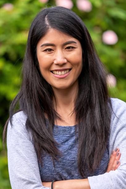 istock Asian woman smiling posing  looking at the camera 1389590637