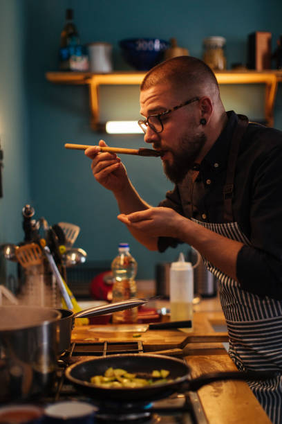 istock Tasting food during cooking 1389592333