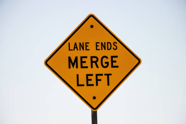 Lane ends merge left sign