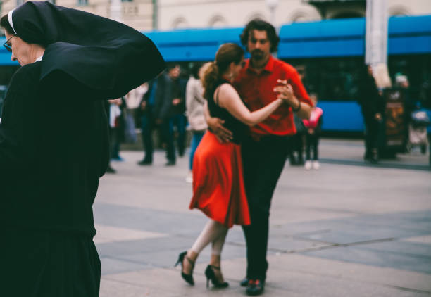 Latino dancers in ballroom isolated on black background