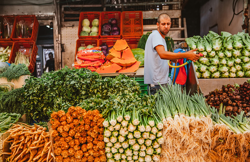 Tel Aviv, Israel, April 30 2022: Locals and tourists shopping at Carmel Market during weekends, Carmel market is a very popular marketplace in Tel Aviv sells mostly food and home accessories goods.