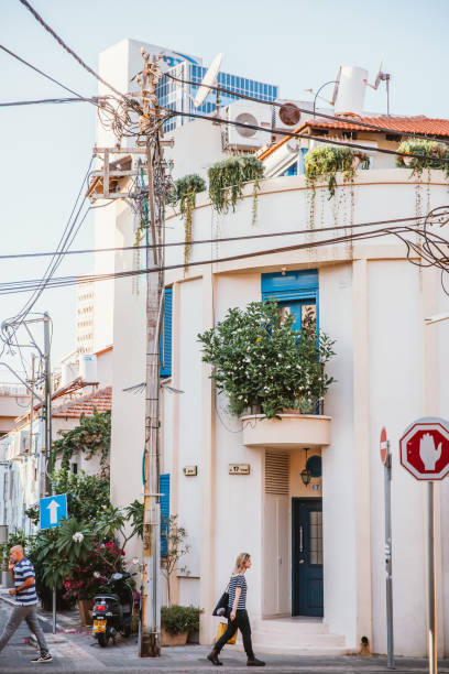 Tel Aviv, Israel, April 29 2022: Locals and tourists walking on street and seaside enjoying the sunshine and laid-back lifestyle in Tel Aviv, which is the most east part of Mediterrean Sea.