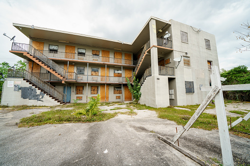 Miami, FL, USA - April 3, 2022: Abandoned housing building in a low income housing market