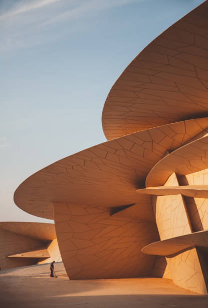 Doha, Qatar - April 20, 2022: Locals walking around in National Museum of Qatar, which is designed by Jean Nouvel and being the landmark of Doha.