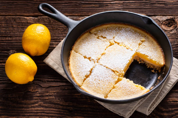 Skillet Lemon Bars Lemon Bars in a Cast Iron Skillet comfort food stock pictures, royalty-free photos & images